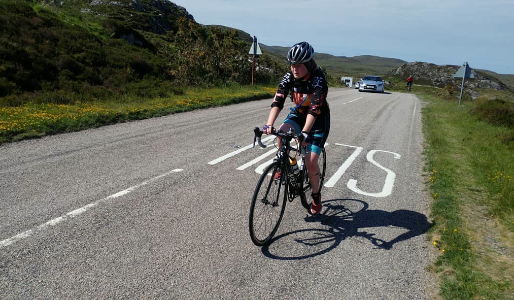 Bethan climbs during her NC500 adventure