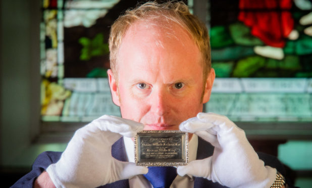 Auctioneer Nick Burns with the rare snuff box.