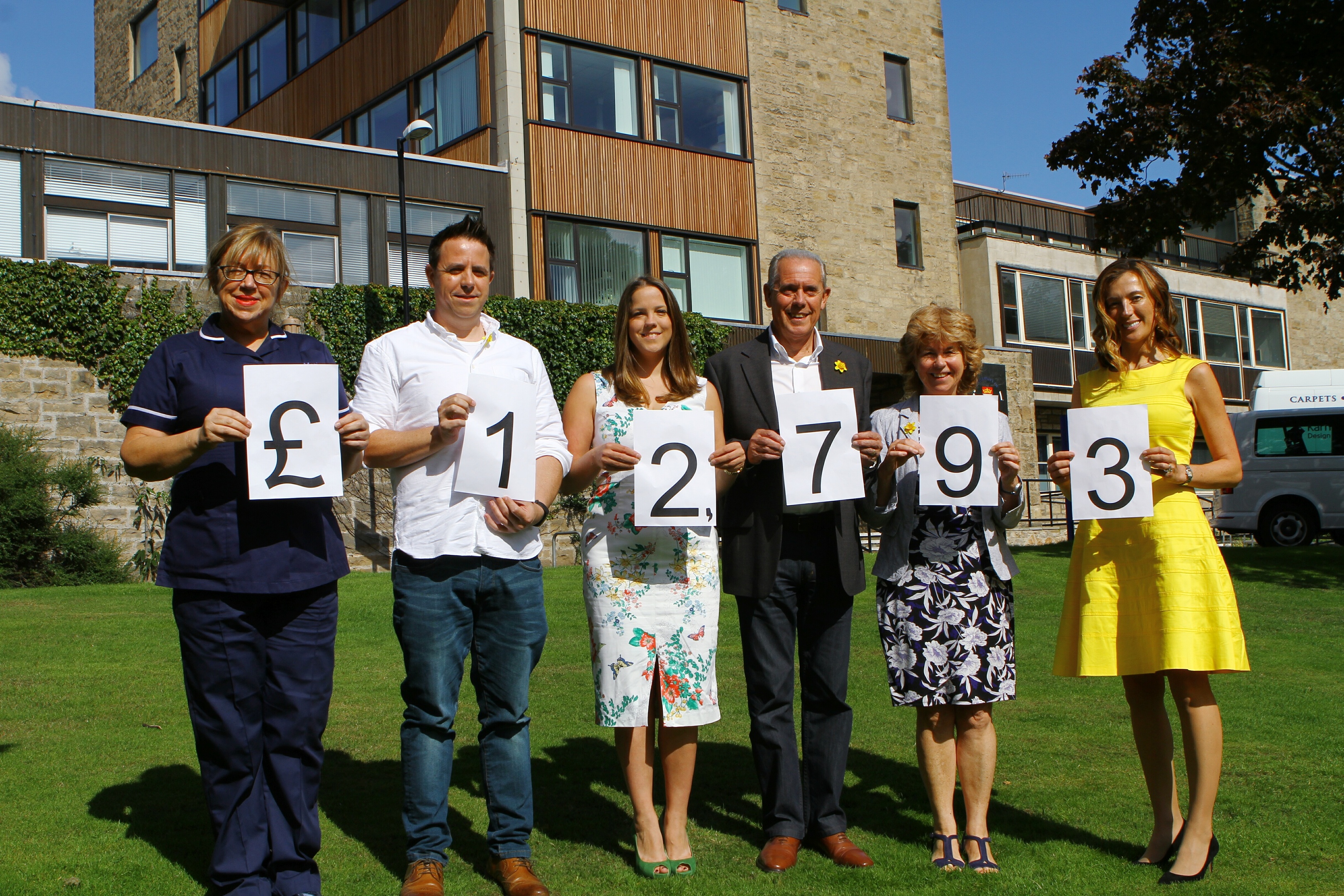 Elaine MacNicoll, Senior Marie Curie Nurse Tayside, with the Lindsay family Peter, Claire, parents Alex and Elizabeth and Marie Cure patron Petra McMillan celebrate the fundraising milestone.