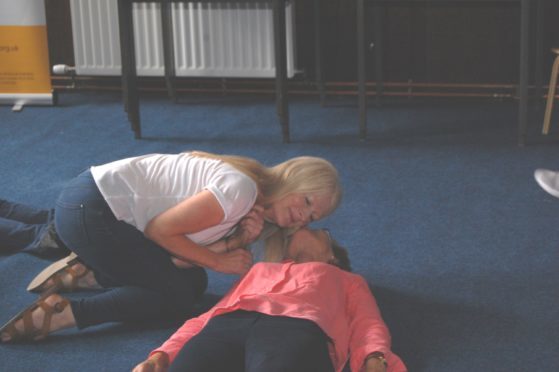 Donna Gibson of Montrose practises resuscitation while Liz McGaw from St Cyrus acts as the casualty.