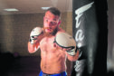 Local lad Frazer has taken up MMA fighting and he's now got a shot at the title.