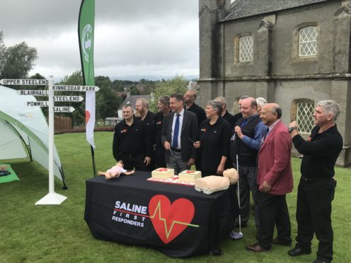 Mr Fraser with the Saline team and councillors David Ross and Mino Manekshaw