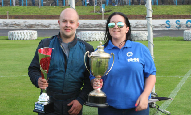 Ian collecting his trophy while suffering from his broken bones