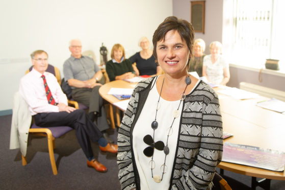 Elaine Colville with members of Lippen Care's executive committee at the Strathmore Hospice in Forfar.