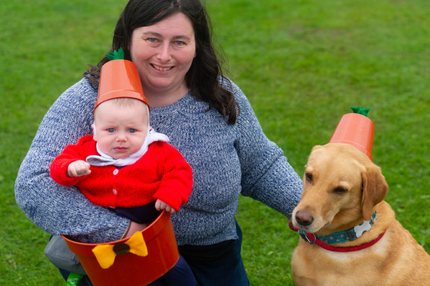 Winners of the children's fancy dress, as Bill and Ben - Andrew (6mths) his mum Kirsty McIntosh and Ruby.