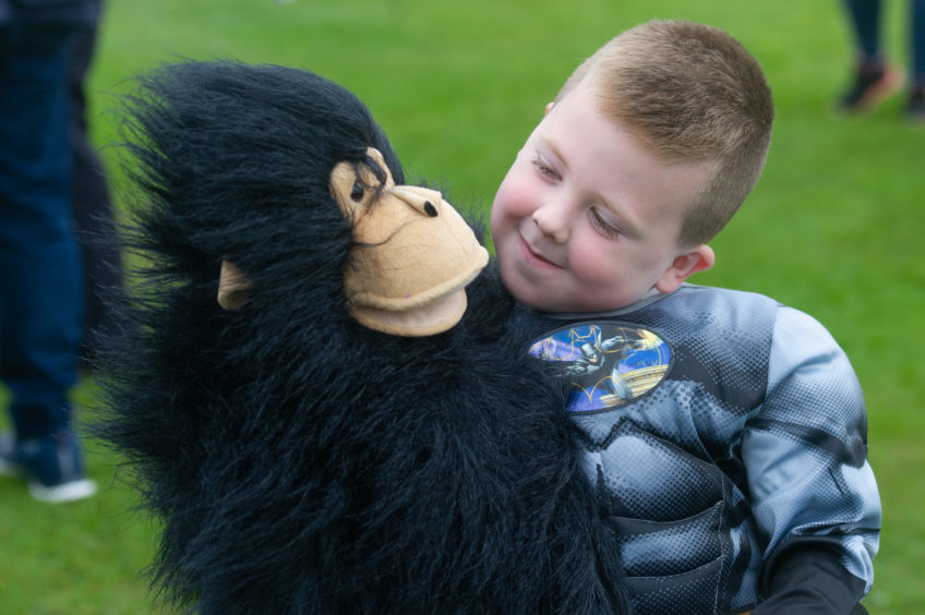 One of the joint winners of the children's fancy dress, Cody Weir (6) enjoys his monkey prize.