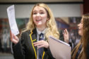 Taylor Williams reacting after opening her results.