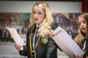 Taylor Williams (who got results to get her in to St Andrews uni) at Kirkcaldy High reacting after opening results in front of pupils teachers and parents.