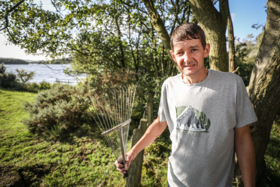 Tam Cotter with his rake near where the attack happened.