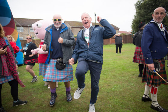 Jim White and Sir Tom Hunter enjoying the stroll.