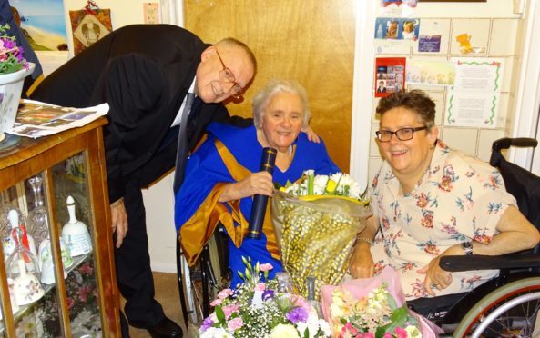 Margaret (middle) with husband David and Yvonne.