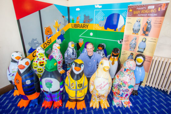 The penguin chicks visited Coldside Library along with project manager Neil Cooney.