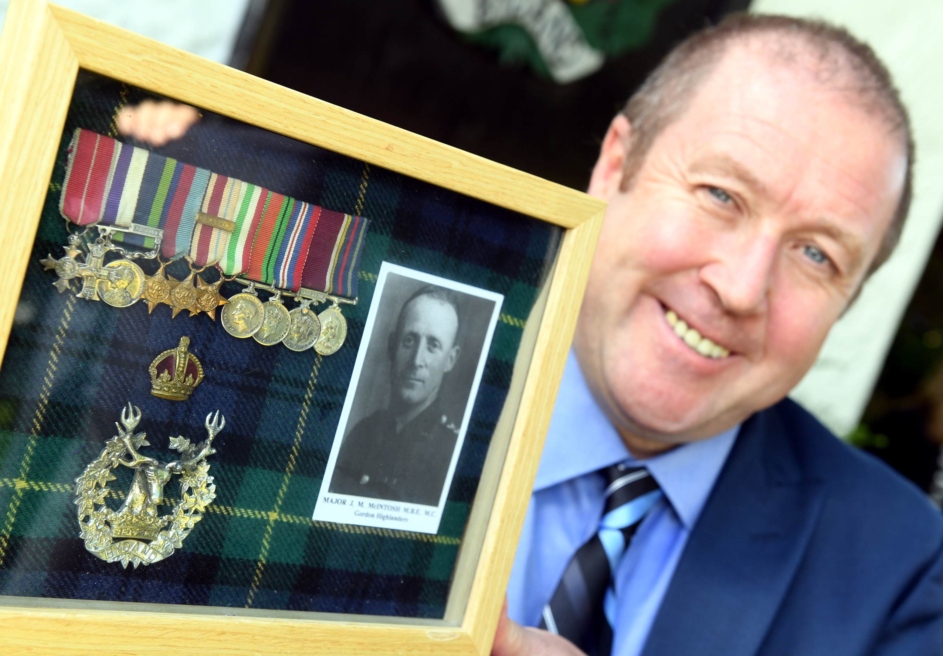 Veterans Minister Graeme Dey visited the Gordon Highlanders Museum, Aberdeen, where after meeting with war veterans he presented his grandfather Major James M McIntosh's medals to display as a long term loan.
