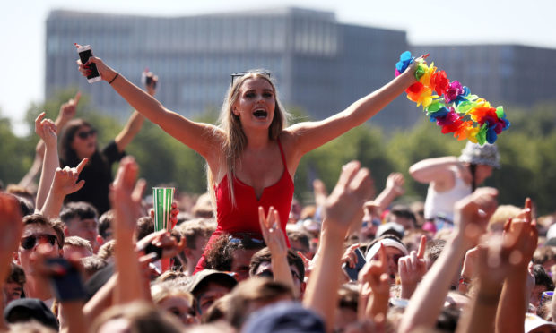 Music fans by the main stage at TRNSMT festival on Glasgow Green in Glasgow.