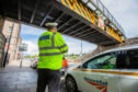 Police and Network Rail at the rail bridge on Tay Street, Perth.