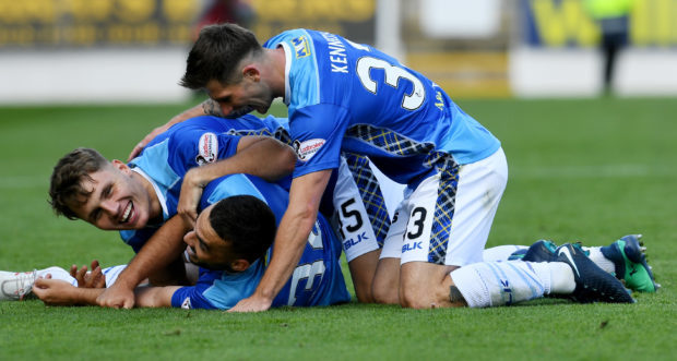 St Johnstone's Tony Watt (centre) celebrates his goal with Jason Kerr and Matty Kennedy.