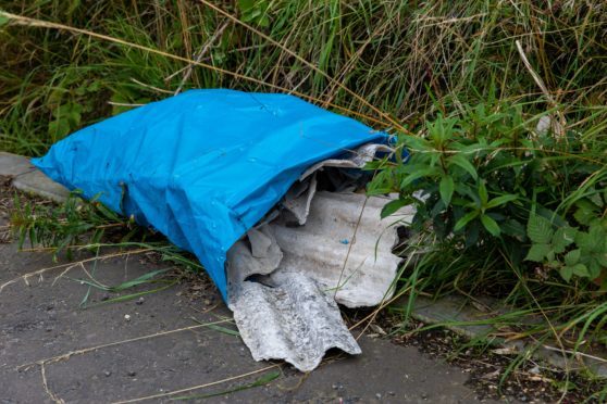 Rubbish dumped on the rural road was feared hazardous
