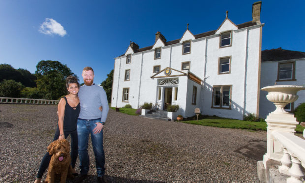 Carphin House owners Ruth and Ian Macallan with dog Hugo