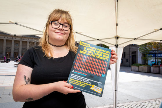 Christina Huttone from Gowrie Care with one of the posters.