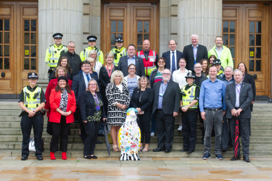 Parents, councillors, council officials and police officersl set off from City Square to walk to three city primary schools.