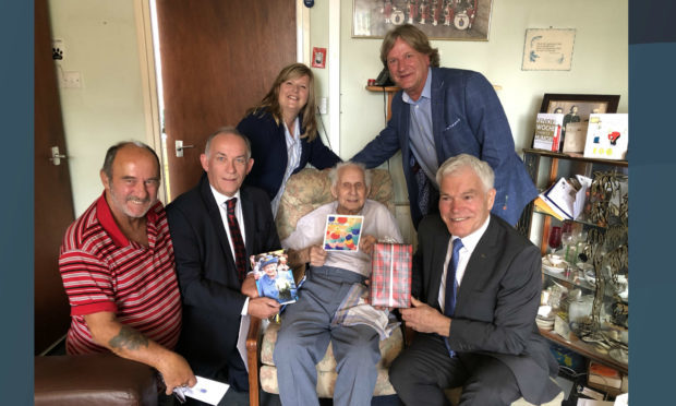 Jimmy, seated, is joined by his carer Archie Howie, Deputy Lieutenant of Fife Jim Kinloch, Councillor Carol Lindsay, David Torrance MSP and Fife Council’s armed forces champion Councillor Rod Cavanagh.