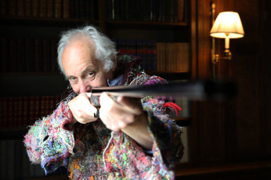 Master gun engraver Malcolm Appleby reunited with his Pheonix gun.