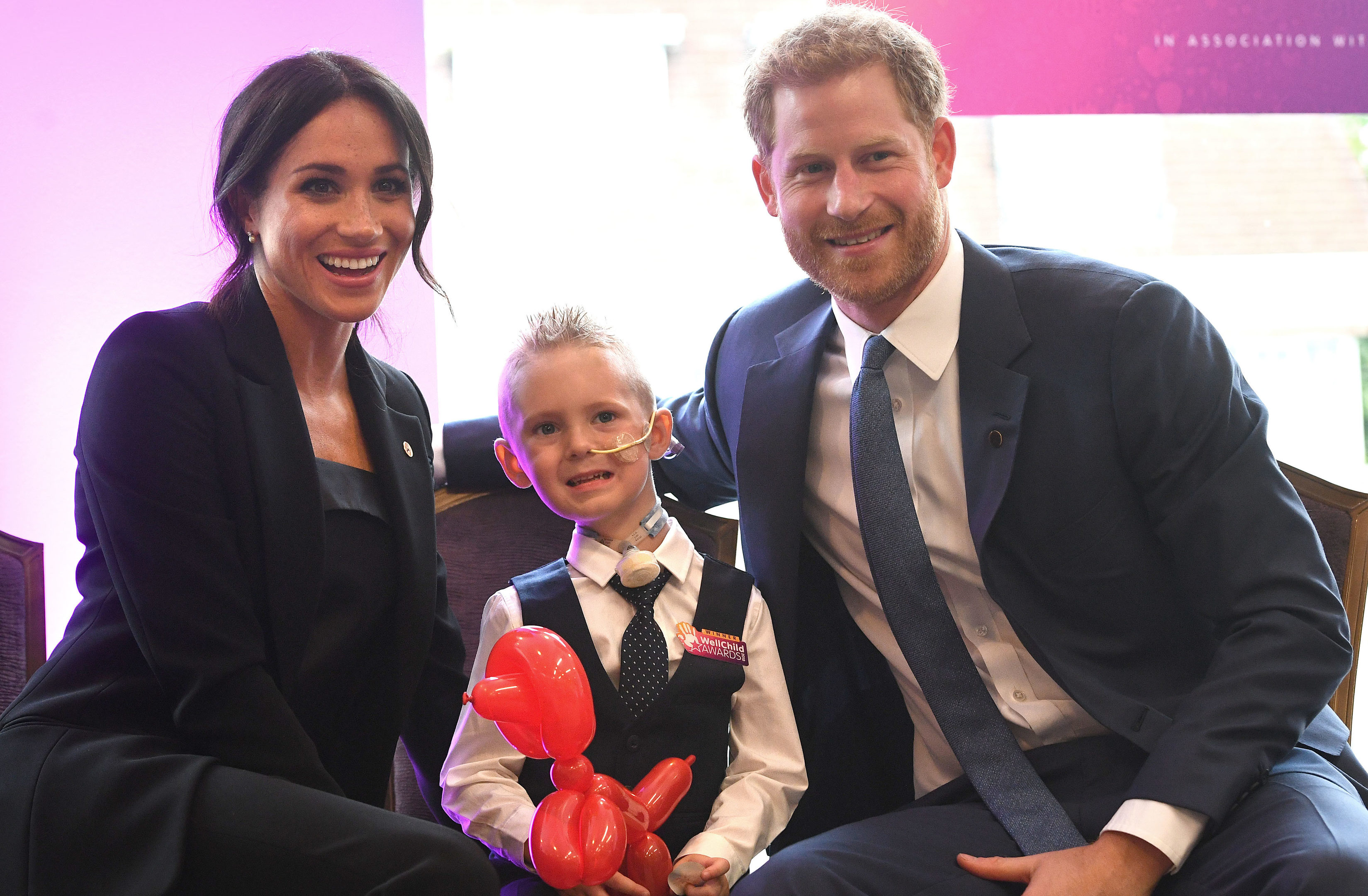 Prince Harry, Duke of Sussex and Meghan, Duchess of Sussex meet four-year-old Mckenzie Brackley during the annual WellChild awards at Royal Lancaster Hotel on September 4, 2018.
