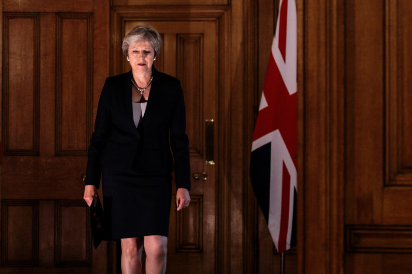 Prime Minister Theresa May arrives to make a statement on Brexit negotiations with the European Union at 10 Downing Street.