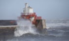 Waves battering the harbour wall at Arbroath.