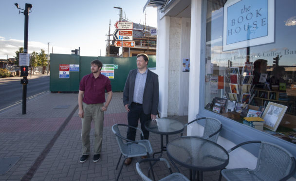 The Bookhouse's Steven Rome and Andrew Rome with the construction behind them