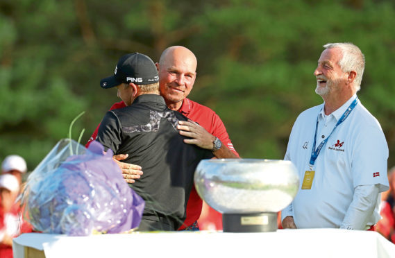 Matt Wallace is embraced by Thomas Bjorn after victory in the Made in Denmark tournament.