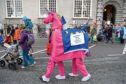 Demonstrators dressed as the "Brexit Unicorn" take part in the March For The Many, calling for a people's vote on the final outcome of the government's Brexit negotiations, during the first day of the annual Labour Party conference.