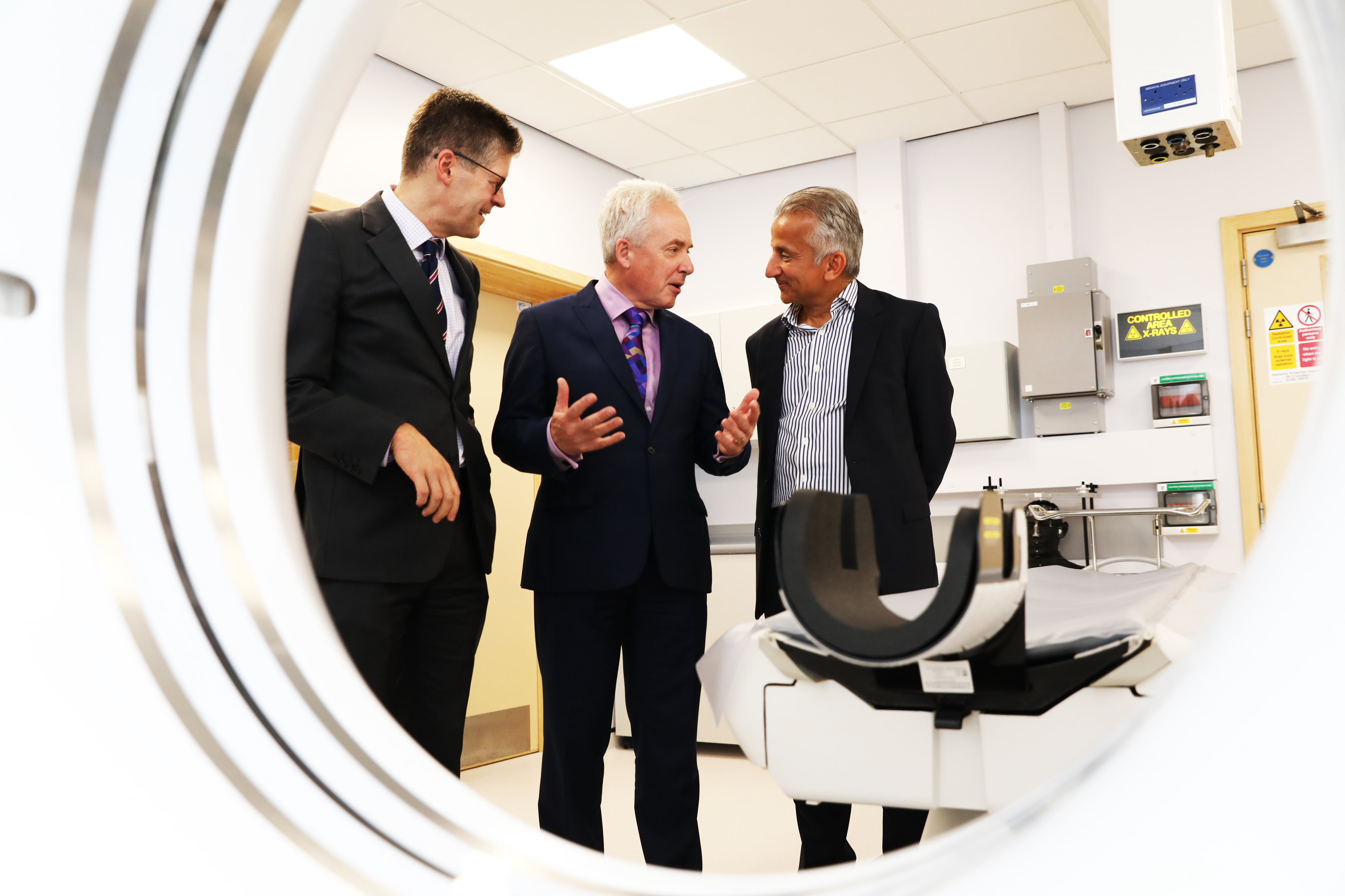 Rory McCrimmon, Dean of the School of Medicine, Chief Executive Malcolm Wright and Professor Dilip Nathwani, Co-Director of AHSP (Academic Health  and Science Partnership) with the new CT Scanner.