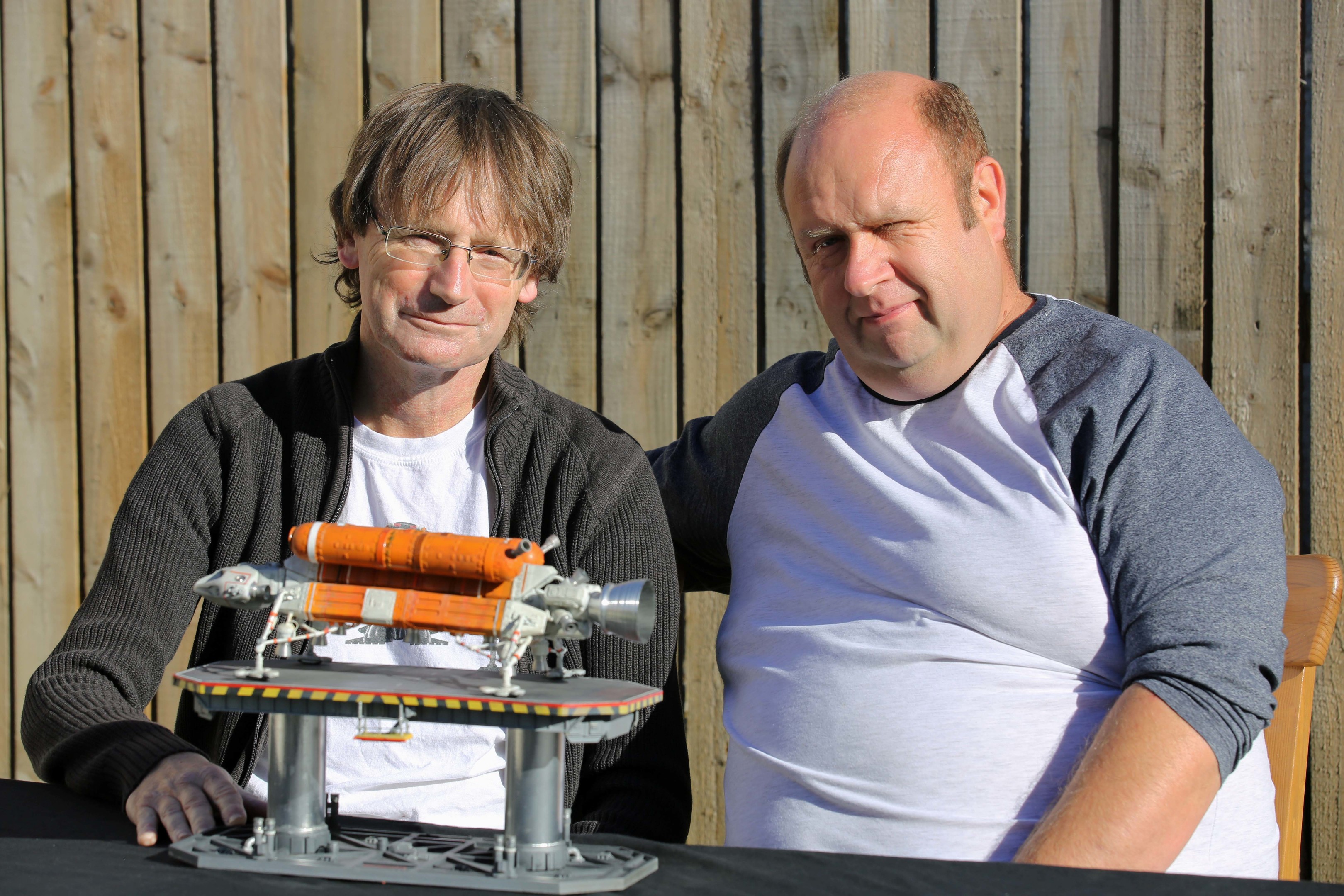 Ronnie Dignan with Rob Carson and the model Eagle Transporter.