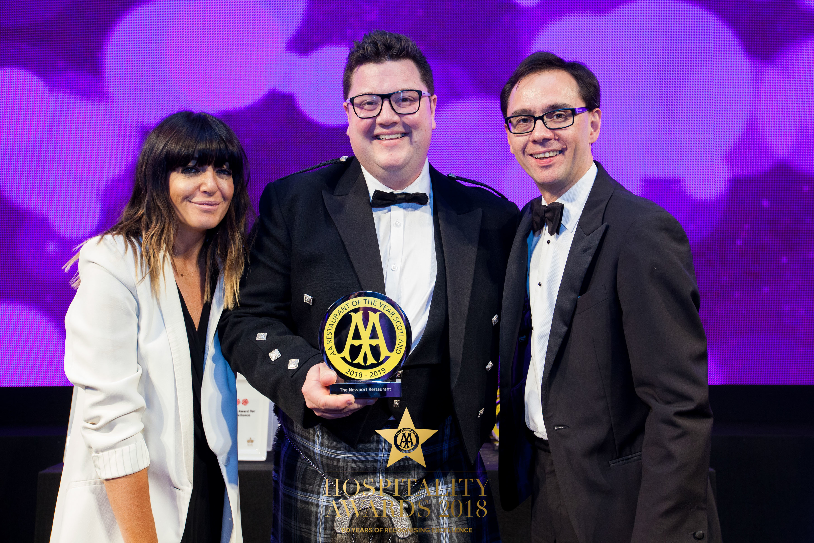 Jamie Scott of The Newport collects his award from Claudia Winkleman and Simon Numphud, managing director of AA Hotel & Hospitality Services.