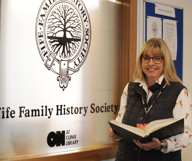 Fife Family History Society chairman Alison Murray and some of the resource material