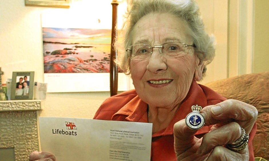Annie Milne with one of her RNLI awards.