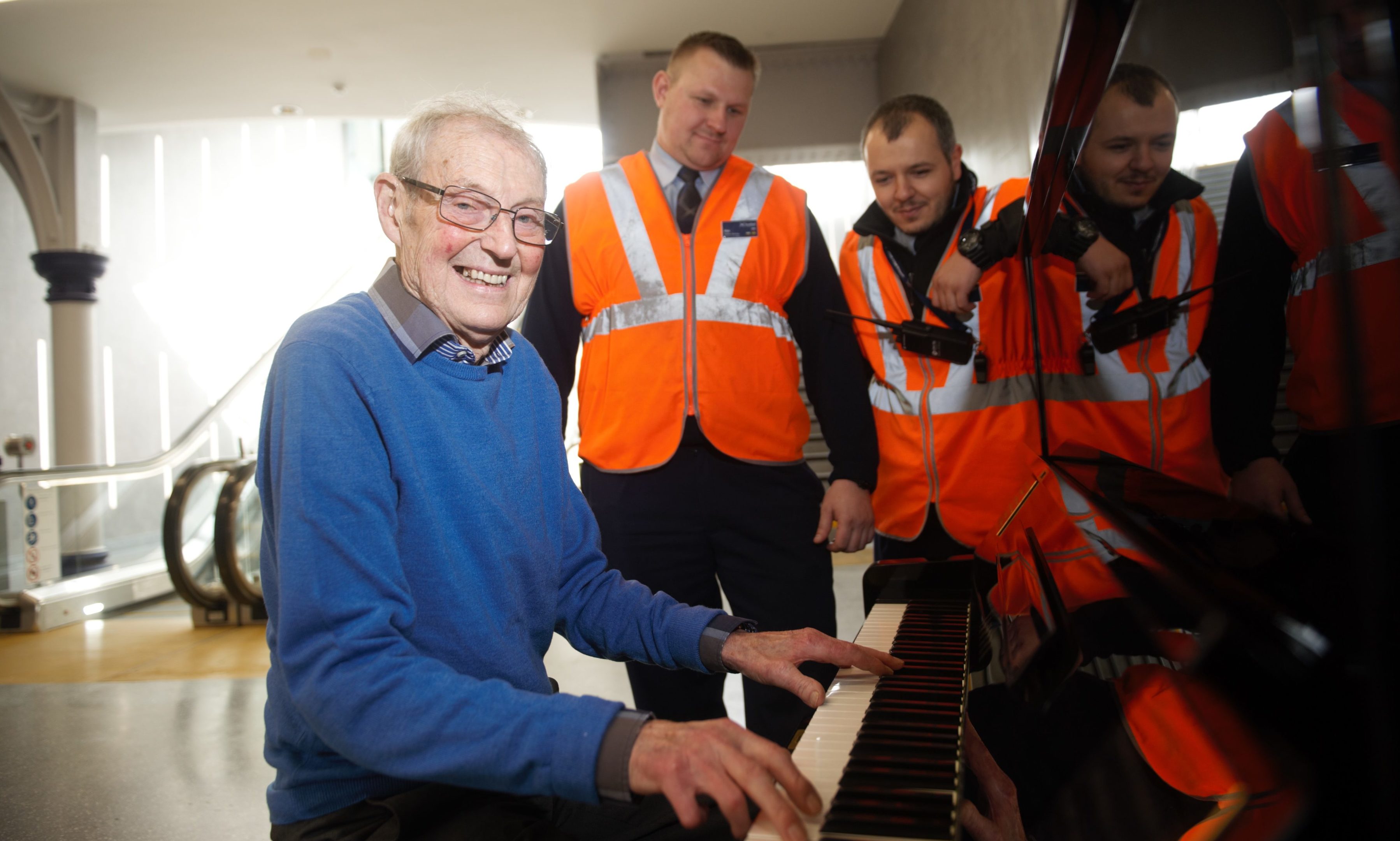 Dave Patterson with ScotRail staff on the day the new piano was installed.