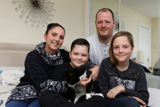 Mum Gill, dad William, Vincent, 9 and Alexa, 11 at home with Lily.