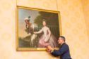 Graham McIntyre, curator at Scone Palace adds new plaque to portrait of Dido Belle and Lady Elizabeth Murray now naming Scots artist David Martin as its creator.