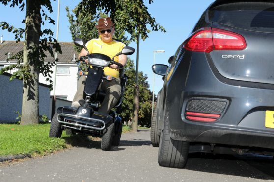 Jim Henderson highlighting the problems disabled people have to put up with by bad parking.