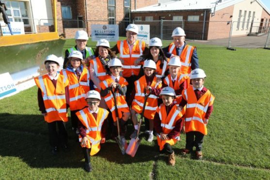 Youngsters were involved in the sod-cutting for the new shared campus.