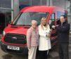 Scott Davidson of Am Phillip Trucktech hands over the keys to Rev Barbara Ann Sweetin, who is accompanied by Eleanor Stewart.