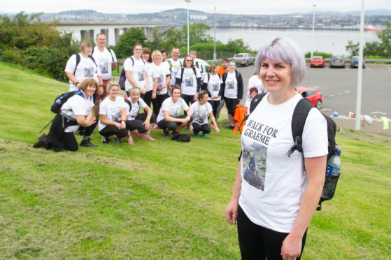 The charity walkers who joined Jenni Bell (front right) on the walk to Cupar Motorcycles  in memory of Graeme,