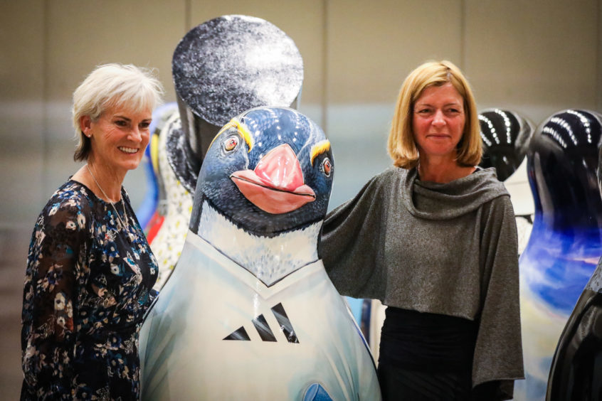 Judy Murray and Laura Lee after Judy won a bid in the auction for a penguin signed for and inspired by her son, Sir Andy Murray.