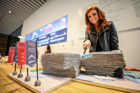 Alice Kennedy, marketing communications officer at the V&A, cuts the cake.