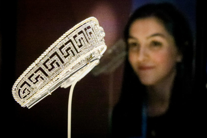 Amy Cochrane looking at a Tiara that was formerly property of Lady Marguerite Allan. Pic: Kris Miller.
