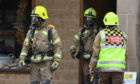Firefighters with breathing apparatus at the Princes Street property on Sunday morning.