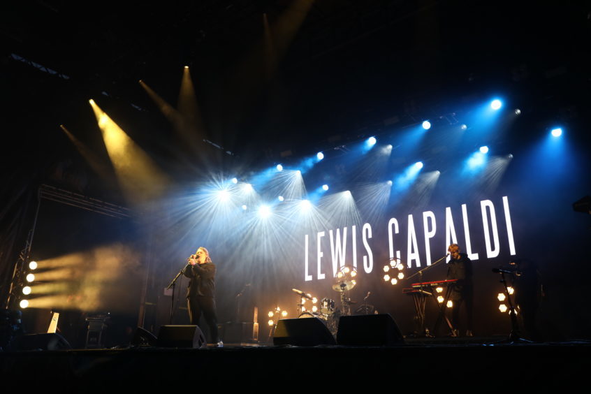 Lewis Capaldi on stage.