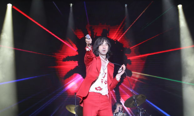 Bobby Gillespie on stage.